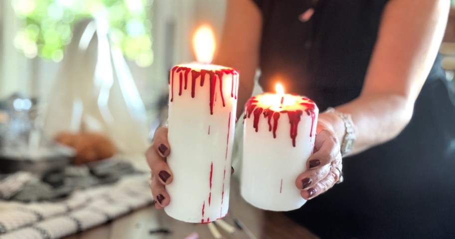 woman holding diy bloody candles