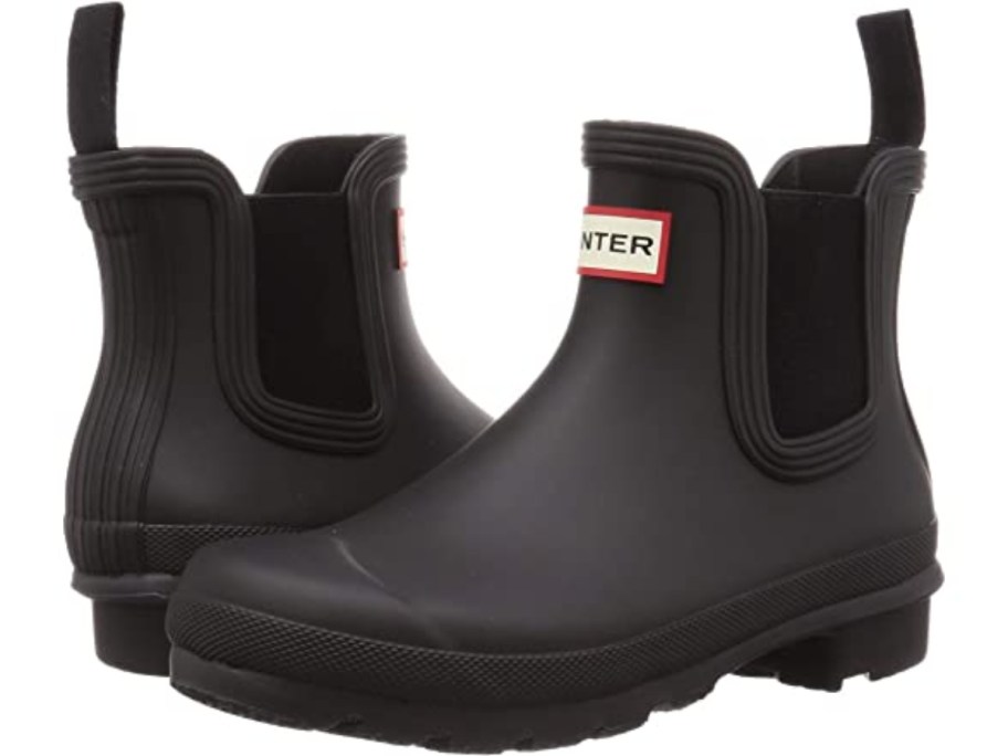 a pair of women's black rubber Hunter Chelsea boots