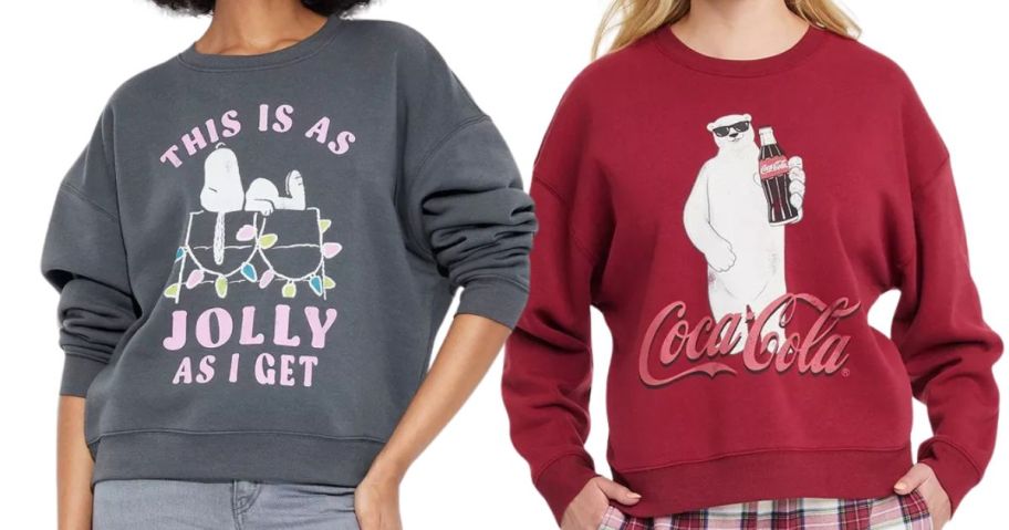 two women wearing snoopy and coca-cola bear sweatshirts