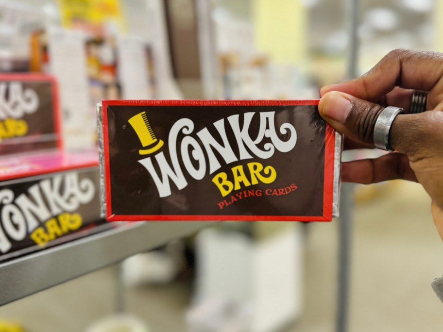 hand holding wonka bar cards