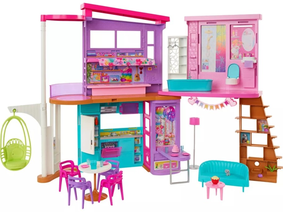 a pink and blue Barbie Vacation House Playset