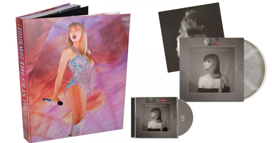 a colorful Taylor Swift Eras Tour book, and grey vinly and CD albums of The Tortured Poets Department