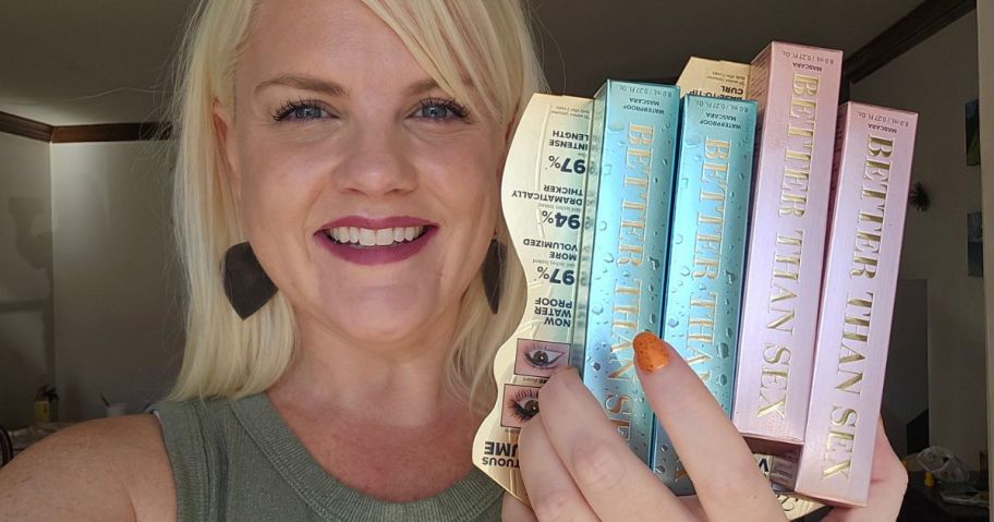 Woman holding four brand new Too Faceed Better Than Sex Mascara in her hand