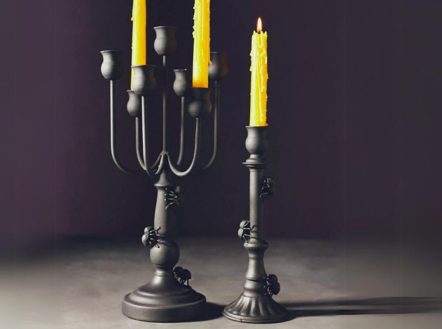 black metal candelabra and single taper candle holders