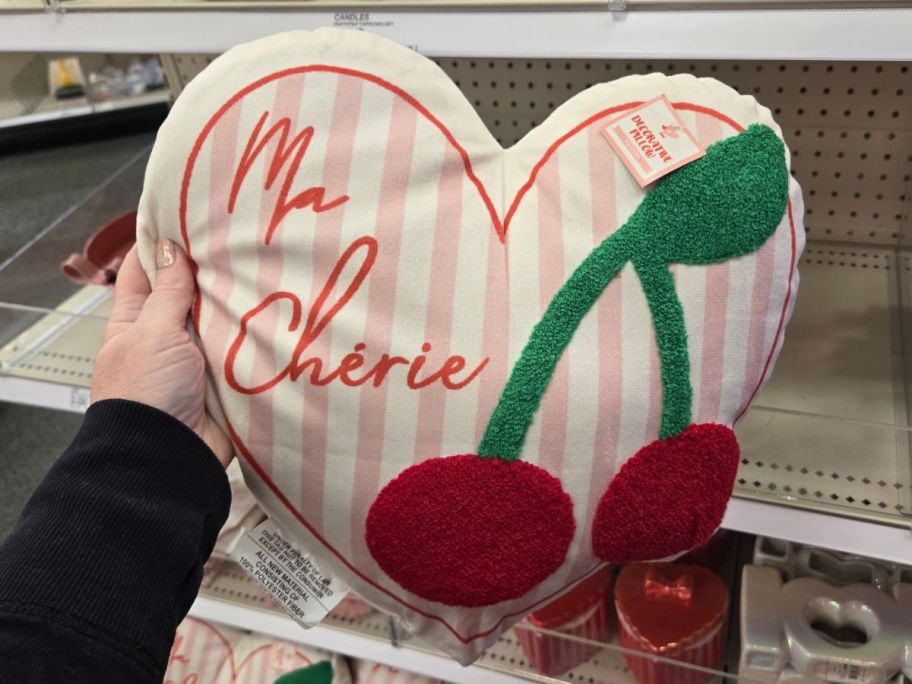 Bullseye Playground Ma Cherie Pillow in hand in store