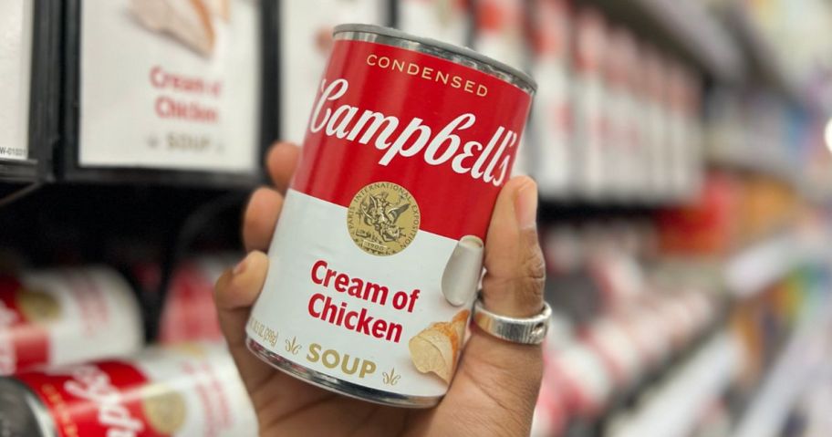 Campbell's Condensed Cream of Chicken Soup 10.5oz Can in hand in store