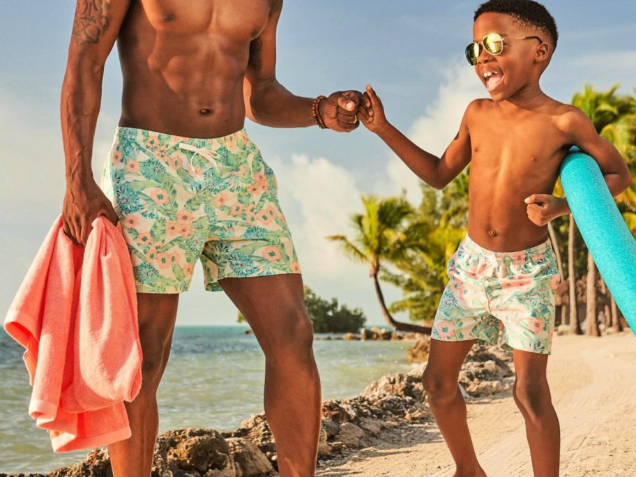 boy and father wearing matching swimwear