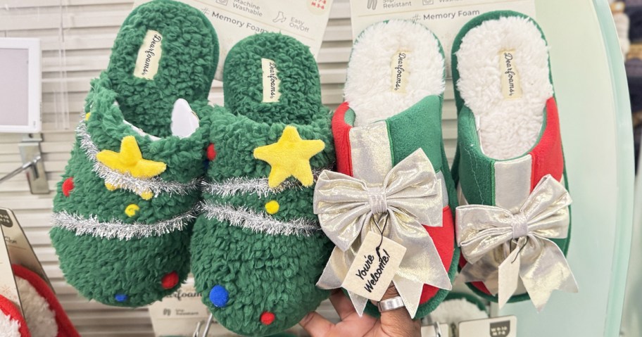 hand touching christmas slippers on store display