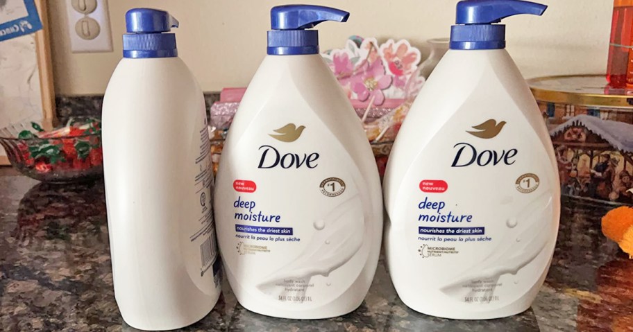 three large bottles of Dove Deep Moisture Body Wash on kitchen counter