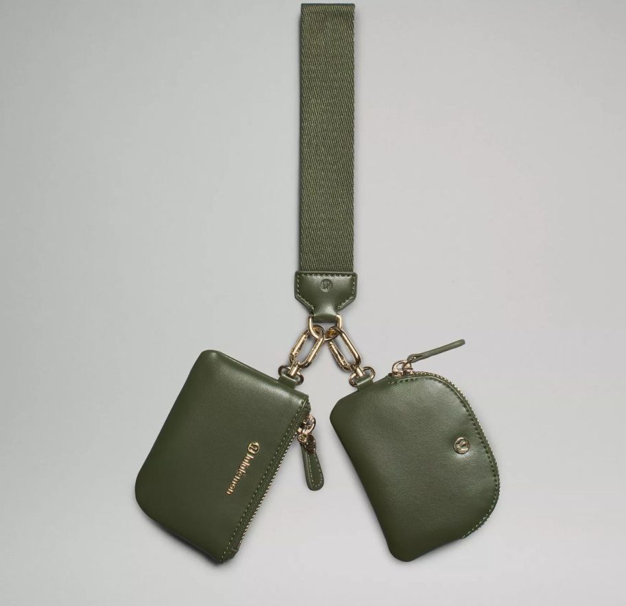 an army green wristlet strap with2 pouches attached to it