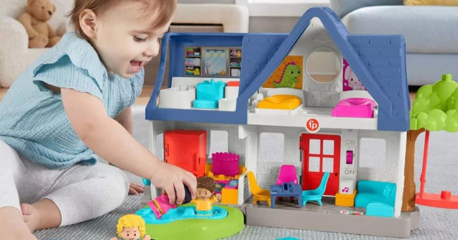 child playing with Fisher-Price Little People Friends Play House