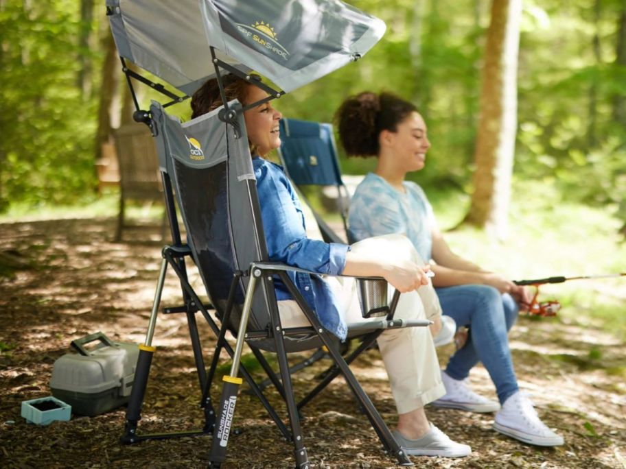 Woman sitting in a GCI Rocker w Sunshade