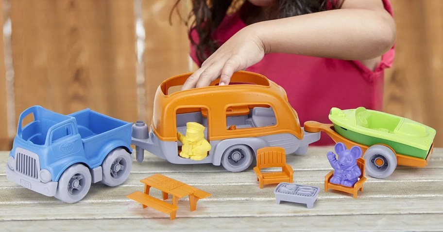 girl playing with Green Toys RV Camper Set