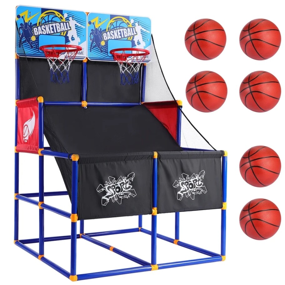 an indoor basketball arcade with 2 shooting sections and hoops and 6 basketballs to the side