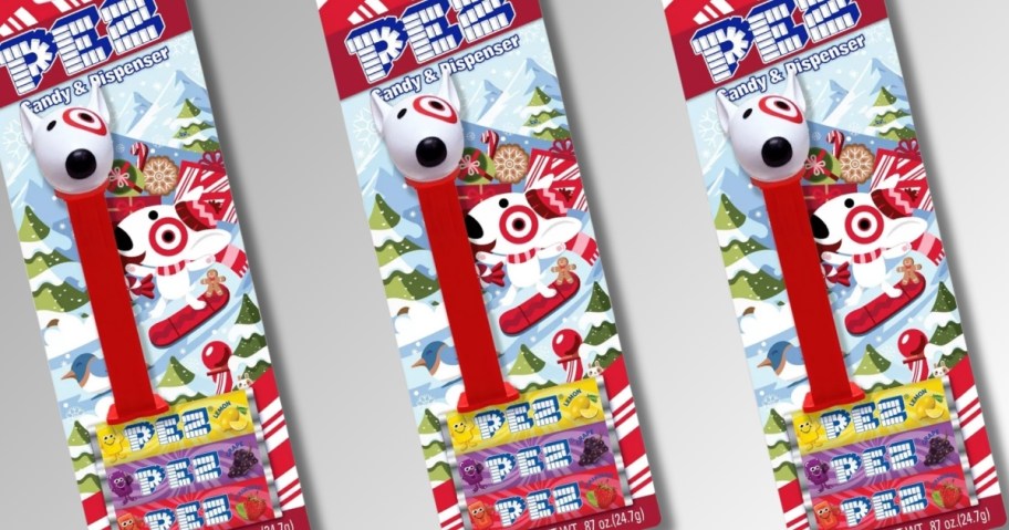 3 packs of Pez Dispensers that are red with the Target Bullseye dog's head at the top and packs of Pez candies below the dispenser