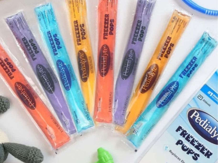 individual packs of Pedialyte Electrolyte Freezer Pops next to a box they onlinee in a table