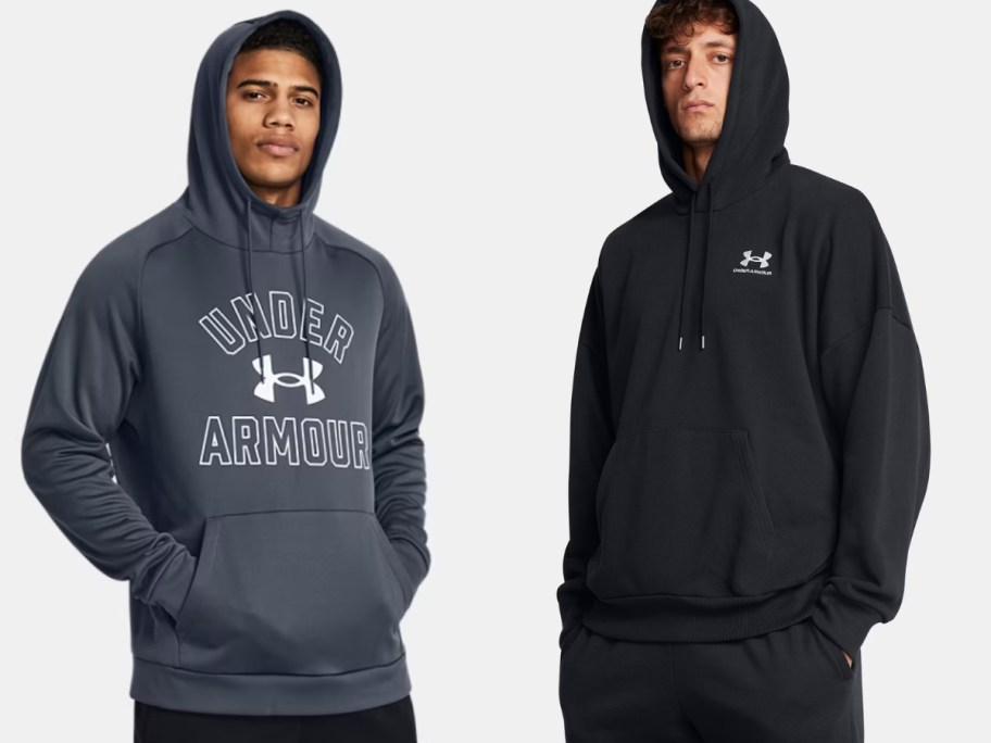 two men wearing Under Armour hoodies with the hoods over their heads, one hoodie is grey with a big logo, one is black with a small logo