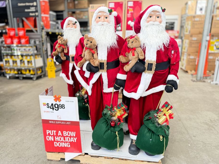 3 Home Accents 5-Foot Standing Santas in the store 