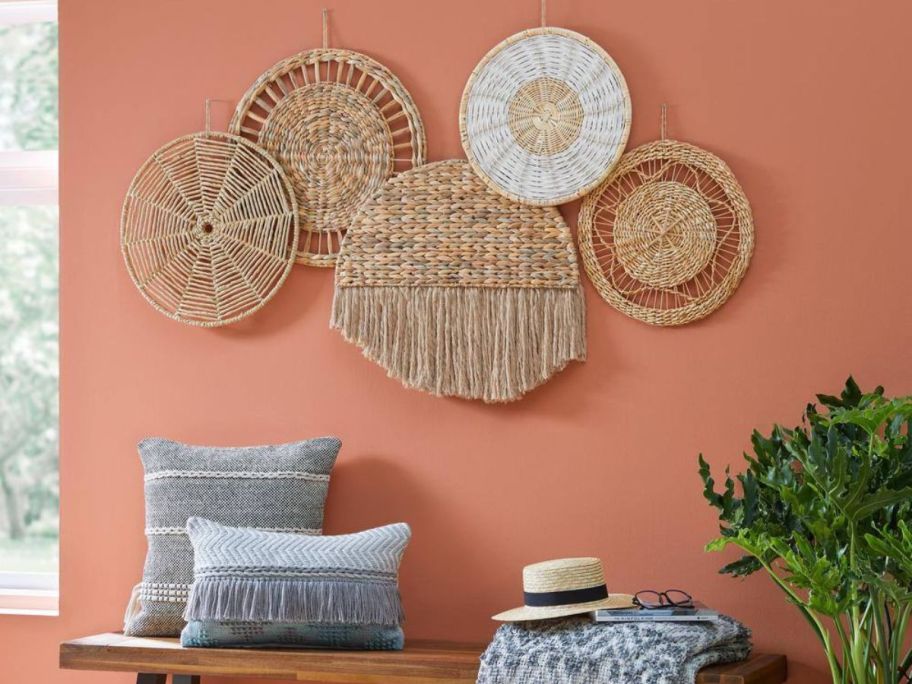 Woven Assorted Hanging Baskets Wall Art on a peach wall 