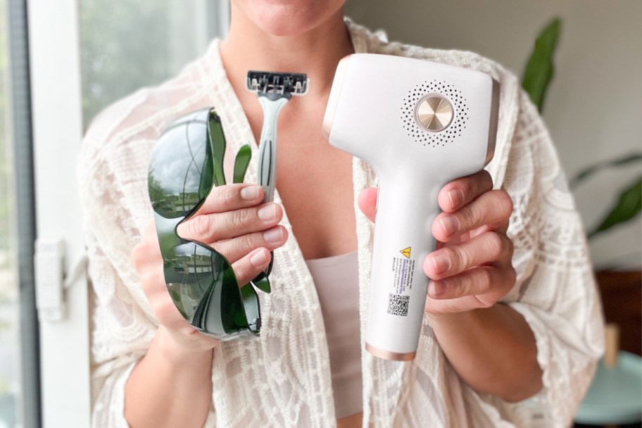 woman holding laser hair remover tool and sunglasses and razor