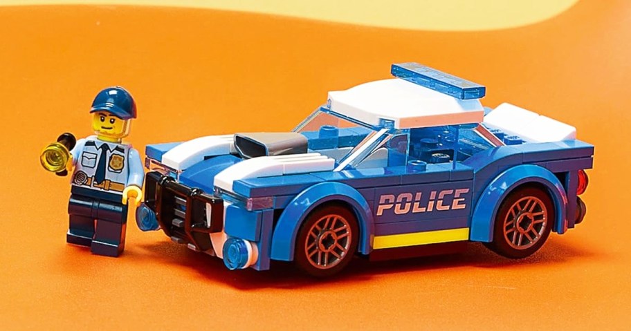 blue lego police car and police man minifigure