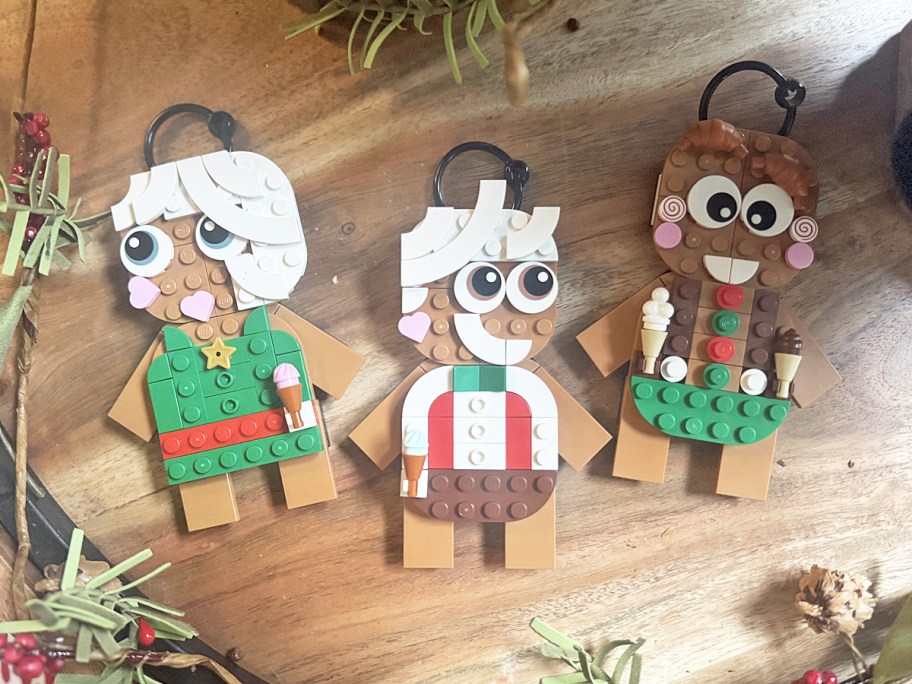 3 lego gingerbread ornaments on wood board