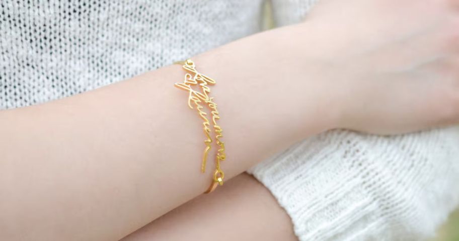 Woman's wrist wearing a Mackenzie Treasury Handwriting Bracelet 