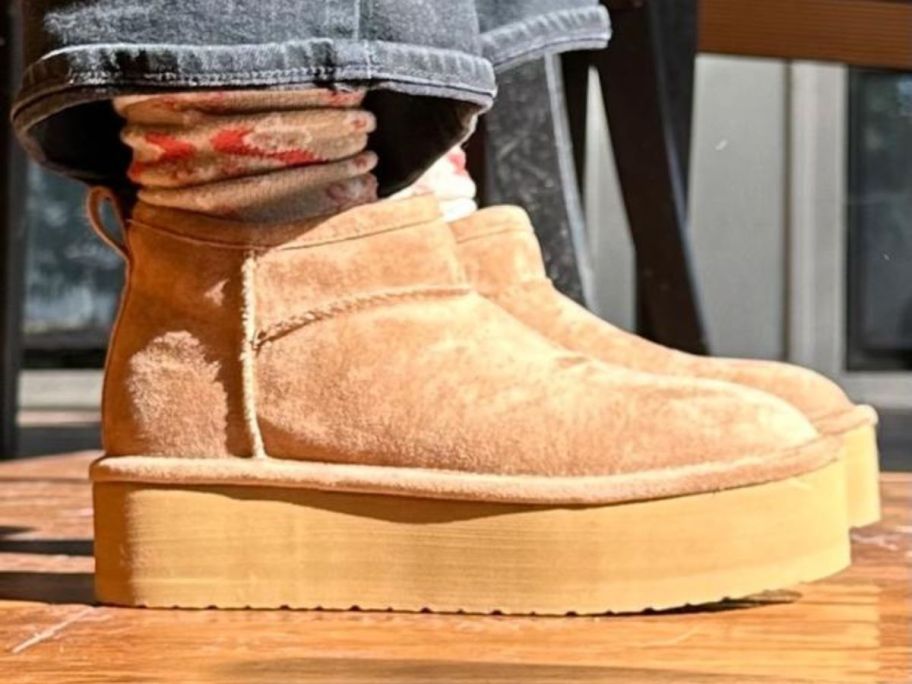woman wearing Madden Girl Platform Booties
