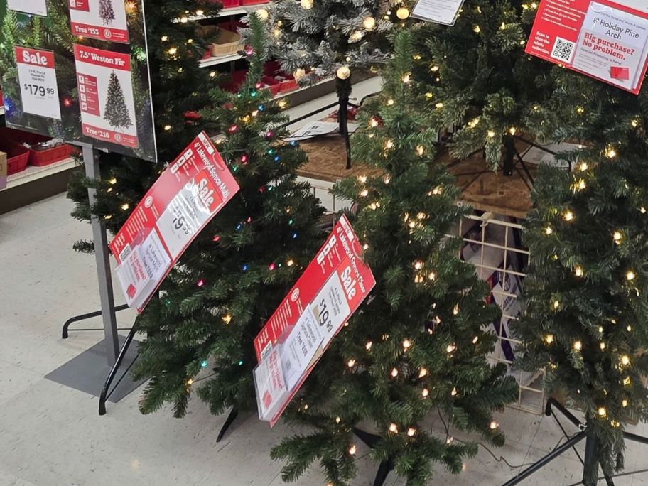 Two small pre-lit christmas trees at Michaels