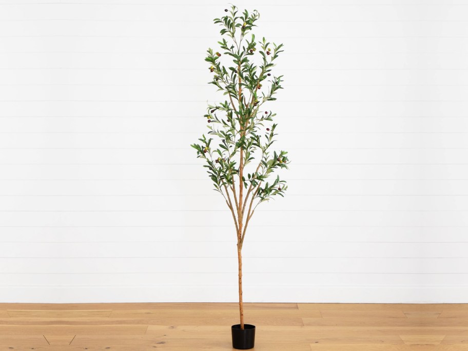 faux olive tree in a small black pot