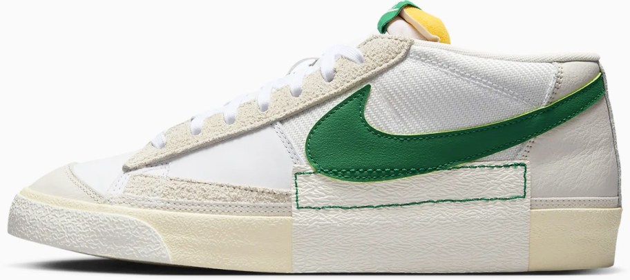 white low cut sneaker with green nike logo