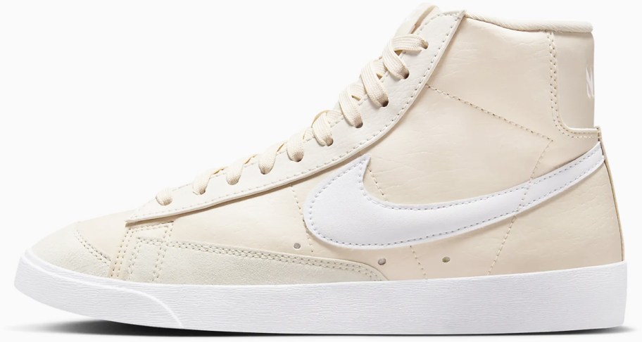 beige high top sneaker with white nike logo