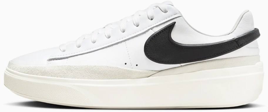 white platform sneaker with black nike logo