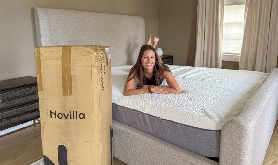 Girl laying on a Novilla mattress, one of the mattress in a box products we reviewed