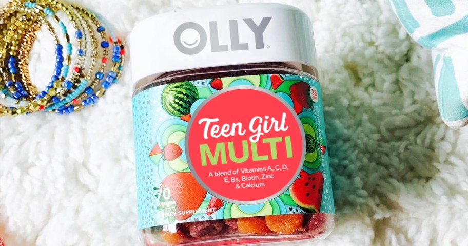 bottle of OLLY Teen Girl Gummy Multivitamins near stack of bracelets