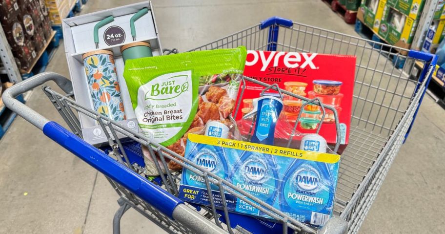 A Sam's Club cart filled with grocery and hosehold items