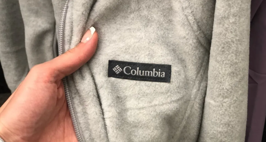 hand holding columbia jacket