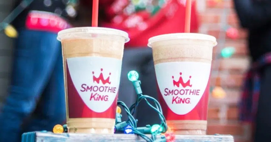 two Smoothie King smoothies near Christmas lights