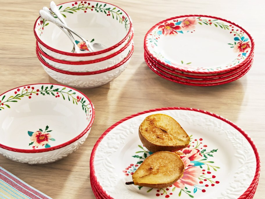 red and white floral print plates and bowls set on wood table