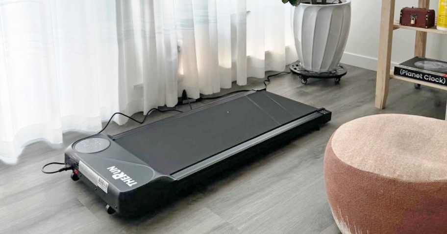 black walking pad in living room