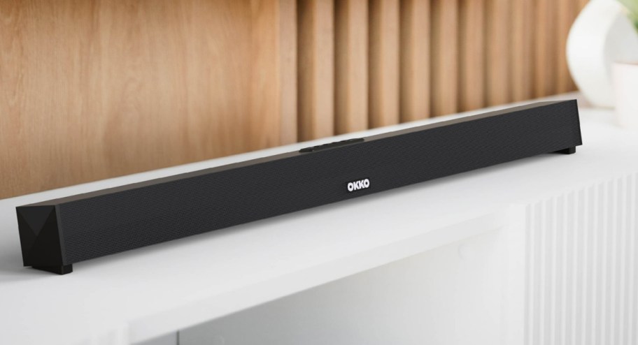 Thin sound bar displayed on top of the counter