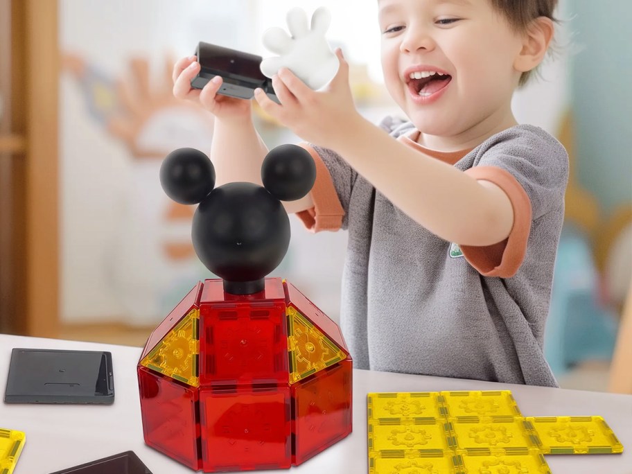 boy playing with Tytan Tiles Mickey Mouse Clubhouse magnetic tiles set