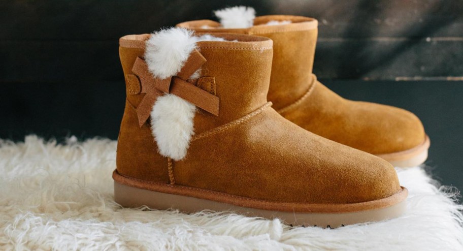 UGG boots displayed on top of a fur rug