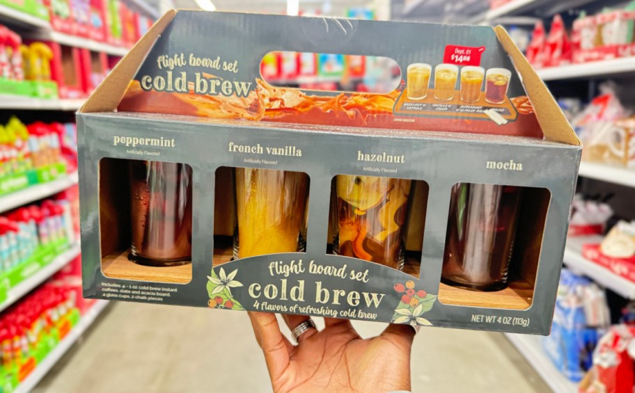 hand holding boxed cold brew flight