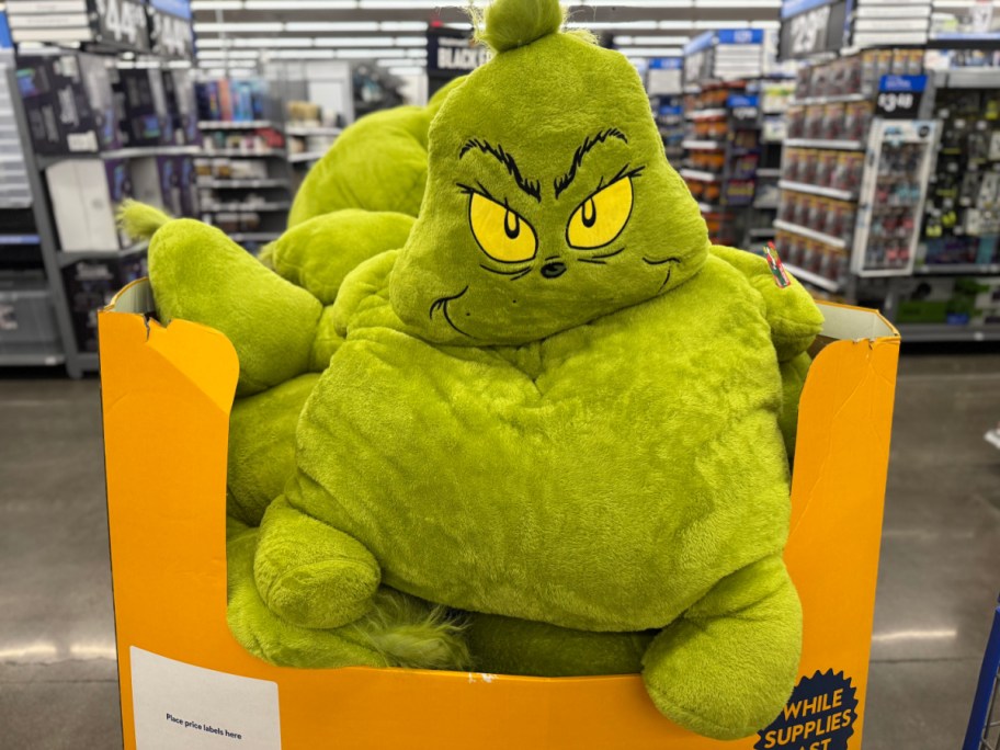 green jumbo grinch plush in walmart store