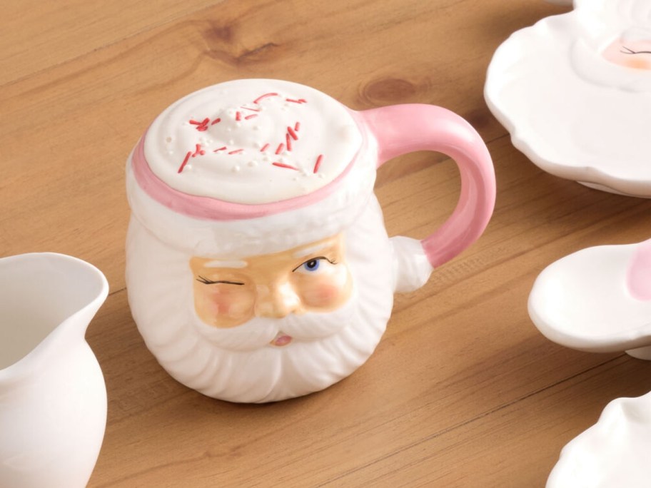 world market winking santa christmas mug with pink accents