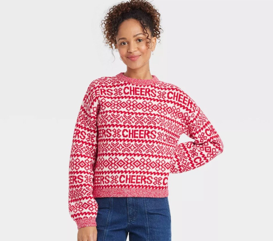 woman modeling red and white cheers sweater