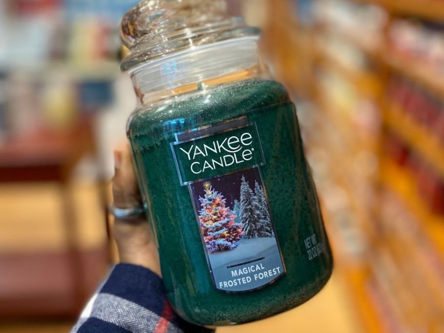 Hand holding a Large Jar Yankee Candle