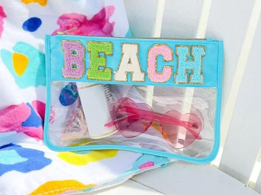 Zipper Pouch - Beach on peach chair with items inside