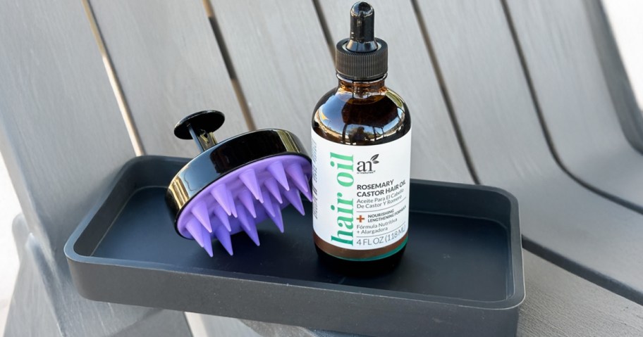 castor oil and scalp massager set in a tray